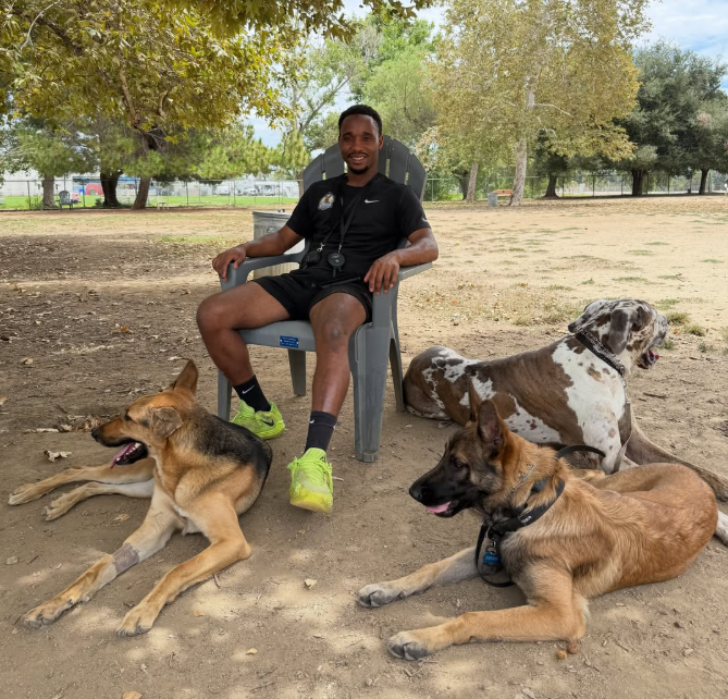 Amigos Paw Training professional working with a calm, focused dog outdoors